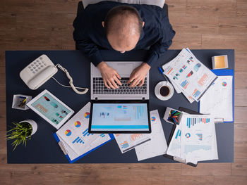 High angle view of man using smart phone