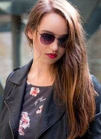 Close-up of beautiful woman wearing sunglasses