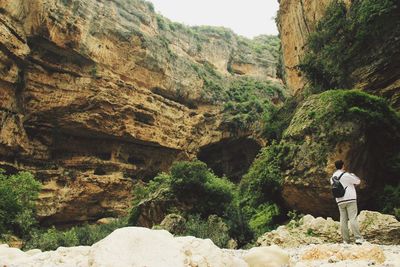 Woman standing on rock formation
