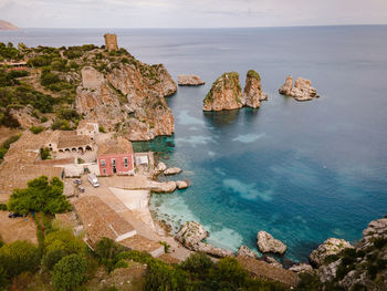 High angle view of rocks on sea