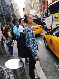 Young woman standing on street