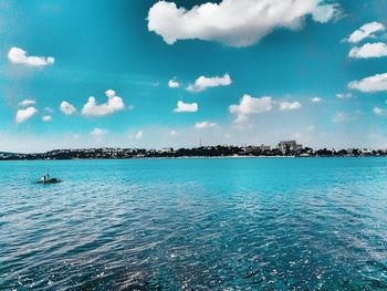 Scenic view of sea against blue sky