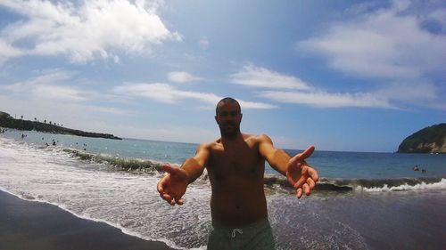 Rear view of boy playing on beach