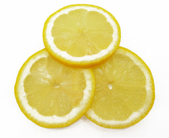 Close-up of lemon slice against white background