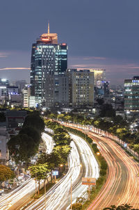 High angle view of illuminated buildings in city at night