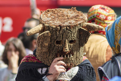 Man wearing costume on street during festival