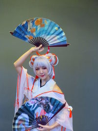 Portrait of a smiling girl holding umbrella