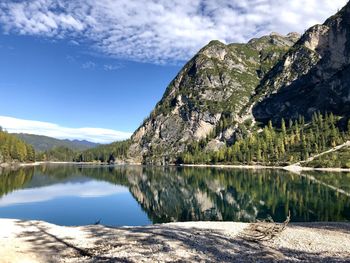 Scenic view of lake and mountains against sky