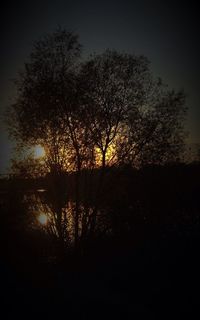 Silhouette of trees against sky at sunset