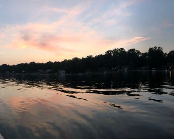 Scenic view of lake against sky during sunset