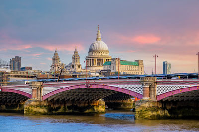 View of bridge over river against sky during sunset