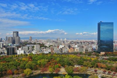 Cityscape against cloudy sky