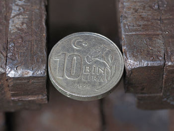 Close-up of old coins on table