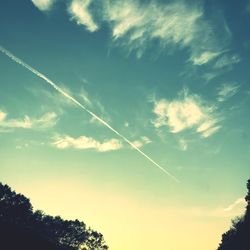 Low angle view of vapor trail in sky