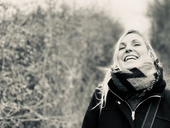 Portrait of a smiling young woman in winter