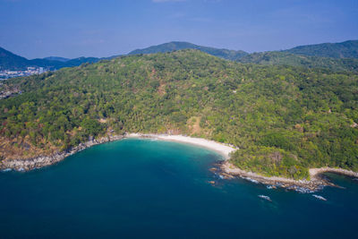 Scenic view of sea and mountains against sky