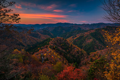 Scenic view of mountains against sky during sunset