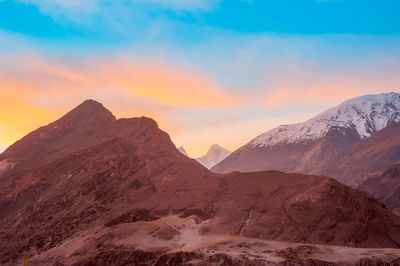 Scenic view of mountains against sky during sunset