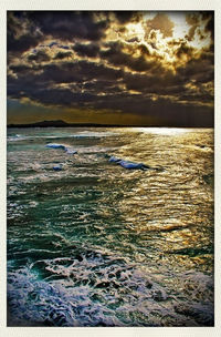 Scenic view of sea against cloudy sky