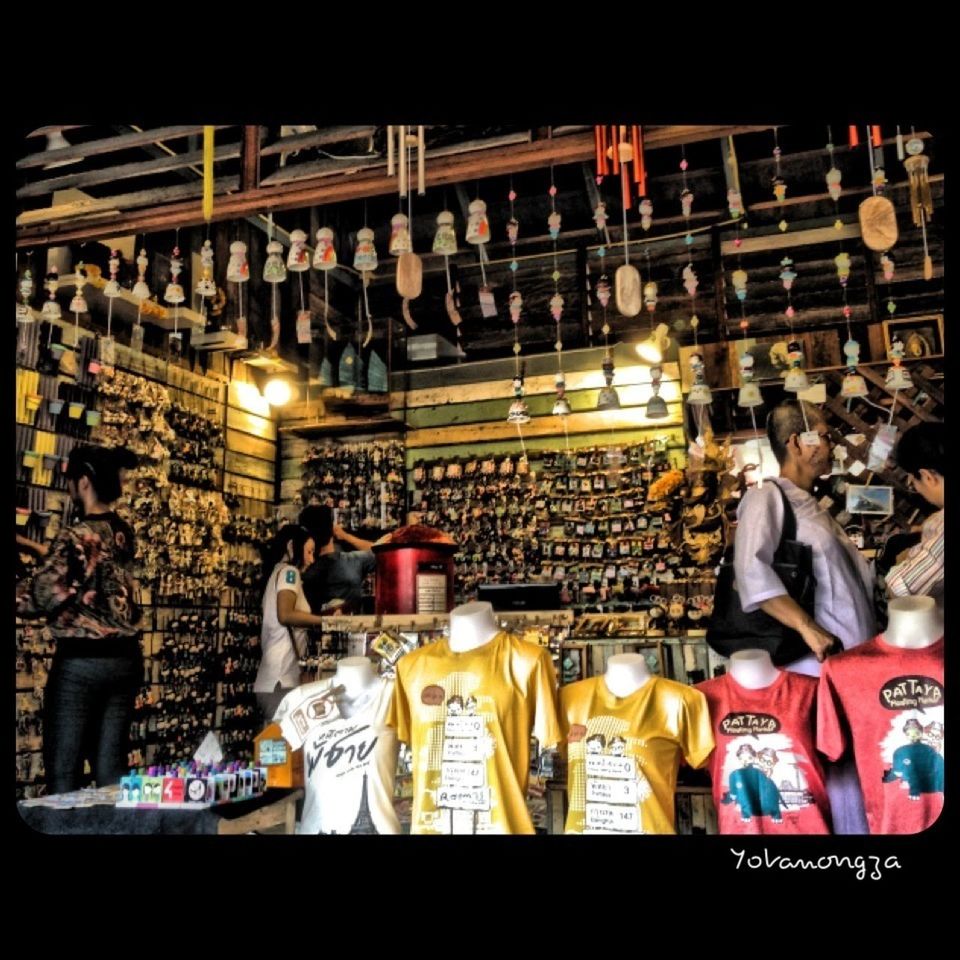 transfer print, illuminated, night, retail, market, indoors, men, market stall, store, large group of objects, auto post production filter, for sale, abundance, shop, in a row, person, large group of people, choice, shopping