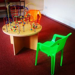 Close-up of multi colored objects on tiled floor