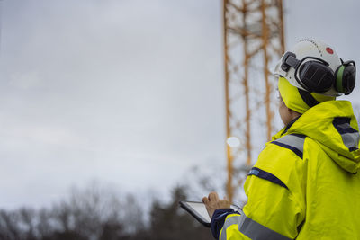 Engineer using digital tablet at building site