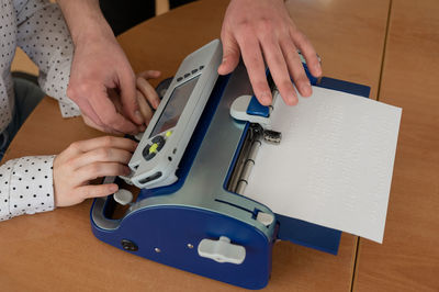 Cropped hands of man working in workshop