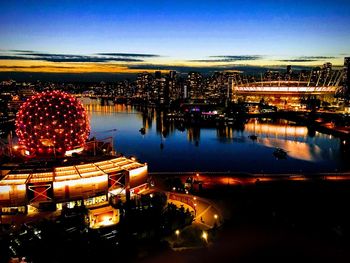 High angle view of illuminated buildings in city at night