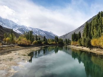 Scenic view of lake and mountains against sky