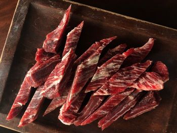 High angle view of meat on cutting board