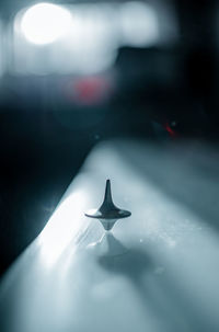 Close-up of illuminated lamp on table