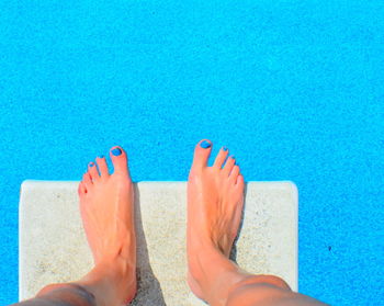 Low section of woman in swimming pool