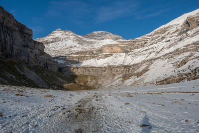 Scenic view of snowcapped mountains against sky