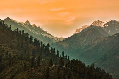 Scenic view of mountains against sky during sunset