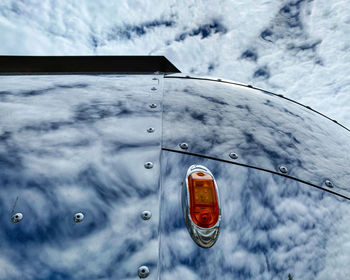 Close-up of glass of car on snow