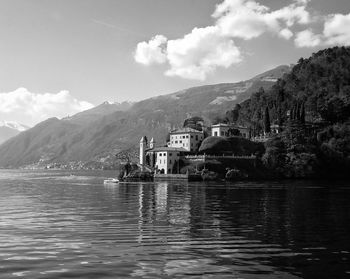 Calm lake with mountains in background