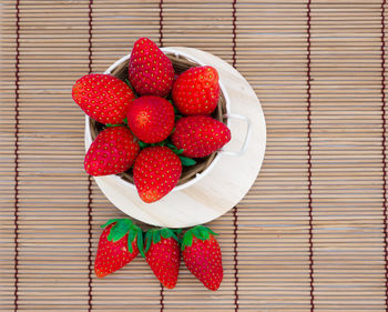 High angle view of strawberries in bowl on table