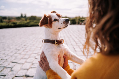 Woman with dog outdoors