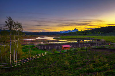 Scenic view of landscape against sky during sunset