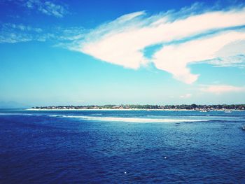 Scenic view of sea against cloudy sky