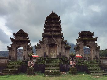 Low angle view of historical building against cloudy sky