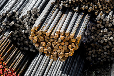 High angle view of stack of logs in forest