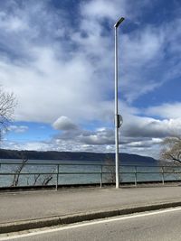 Street by sea against sky