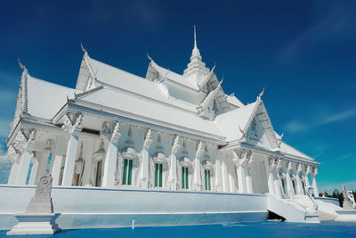 Low angle view of building against blue sky