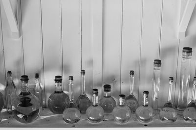 View of empty glass bottles on wall