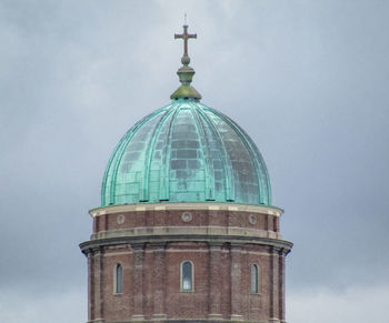 Low angle view of bell tower against sky