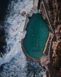 High angle view of sea amidst buildings