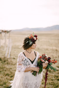 Young woman holding bouquet