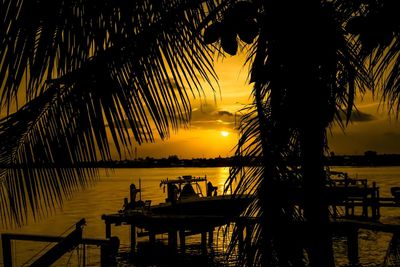 Silhouette of pier at sunset