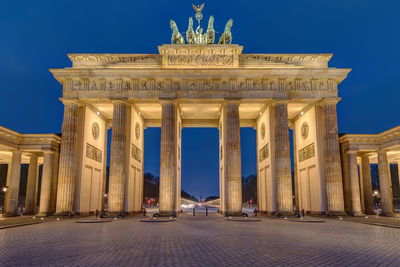 The famous illuminated brandenburger tor in berlin early in the morning